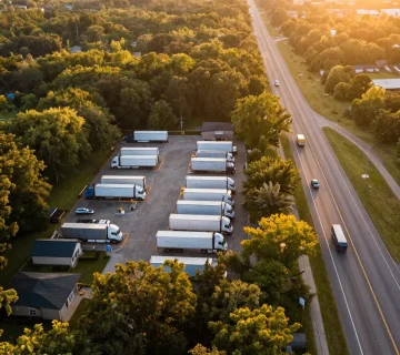 Aerial view of truck parking facility and highway used by Trucking companies in Vancouver BC for regional freight operations