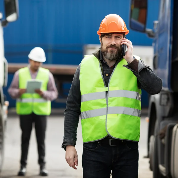 Logistics supervisor coordinating freight operations by phone for a Logistics company in Vancouver