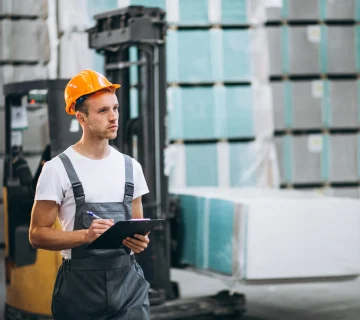 Warehouse employee managing inventory for commercial freight services