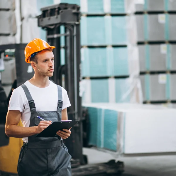 Warehouse employee managing inventory for commercial freight services