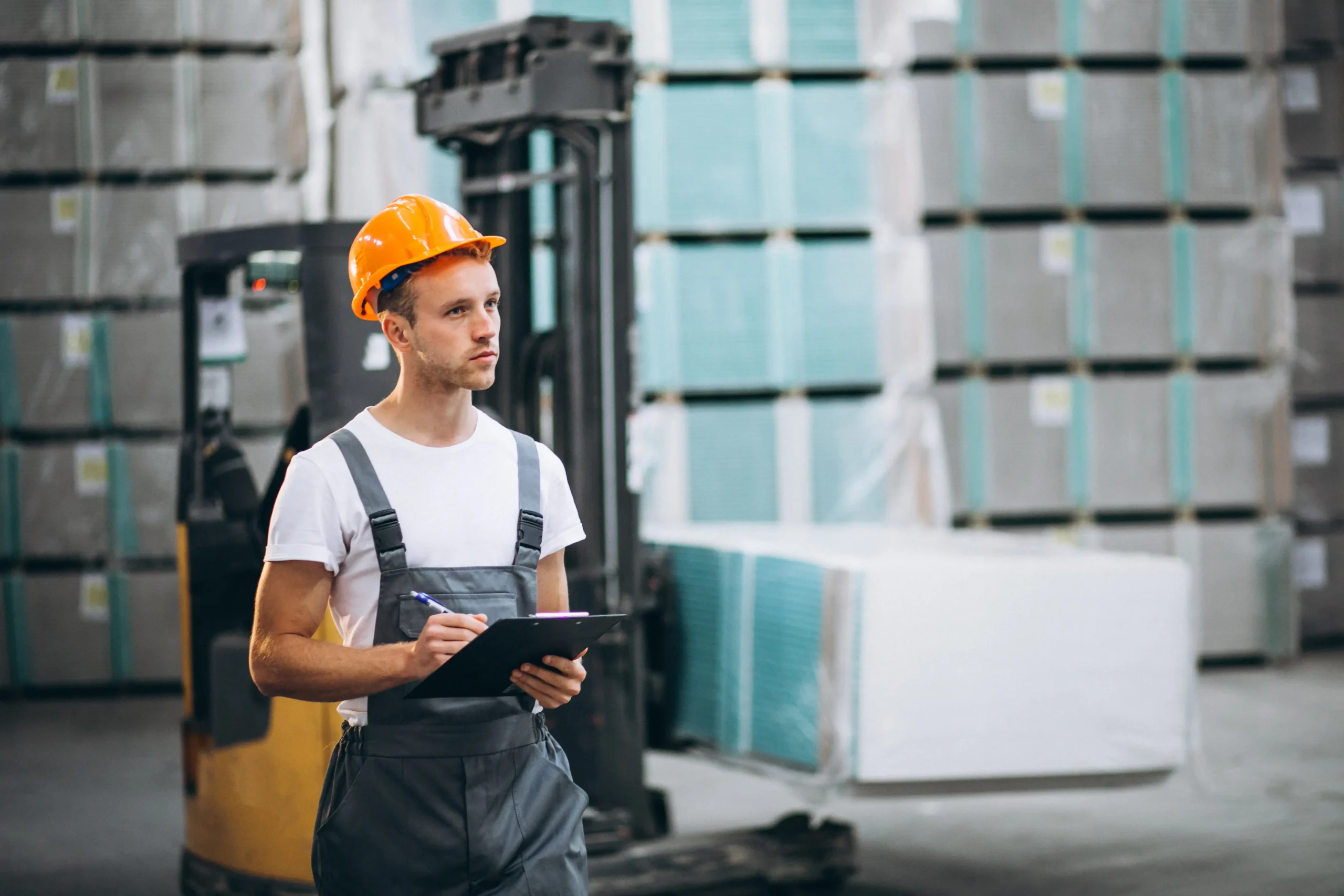Warehouse employee managing inventory for commercial freight services