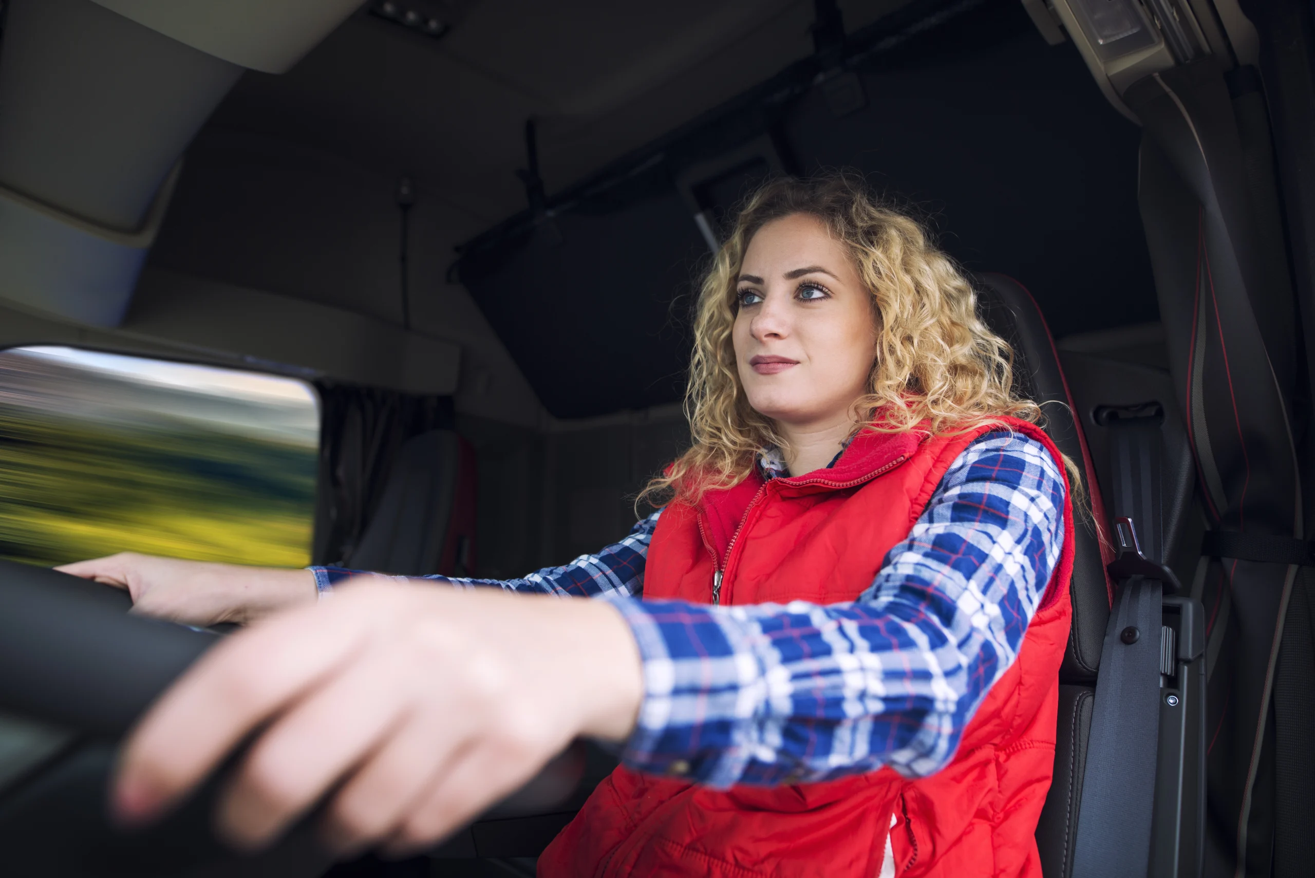 Trucking Operations & Dispatch Canada delivery professional managing cargo inside a commercial transport van